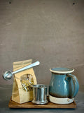 Handmade Loose Leaf Tea Gift Set | Ceramic Bell Mug with Lid, Stainless Steel Infuser, Tea Scoop & Acacia Tray | Riverdrift | GIFT Basket